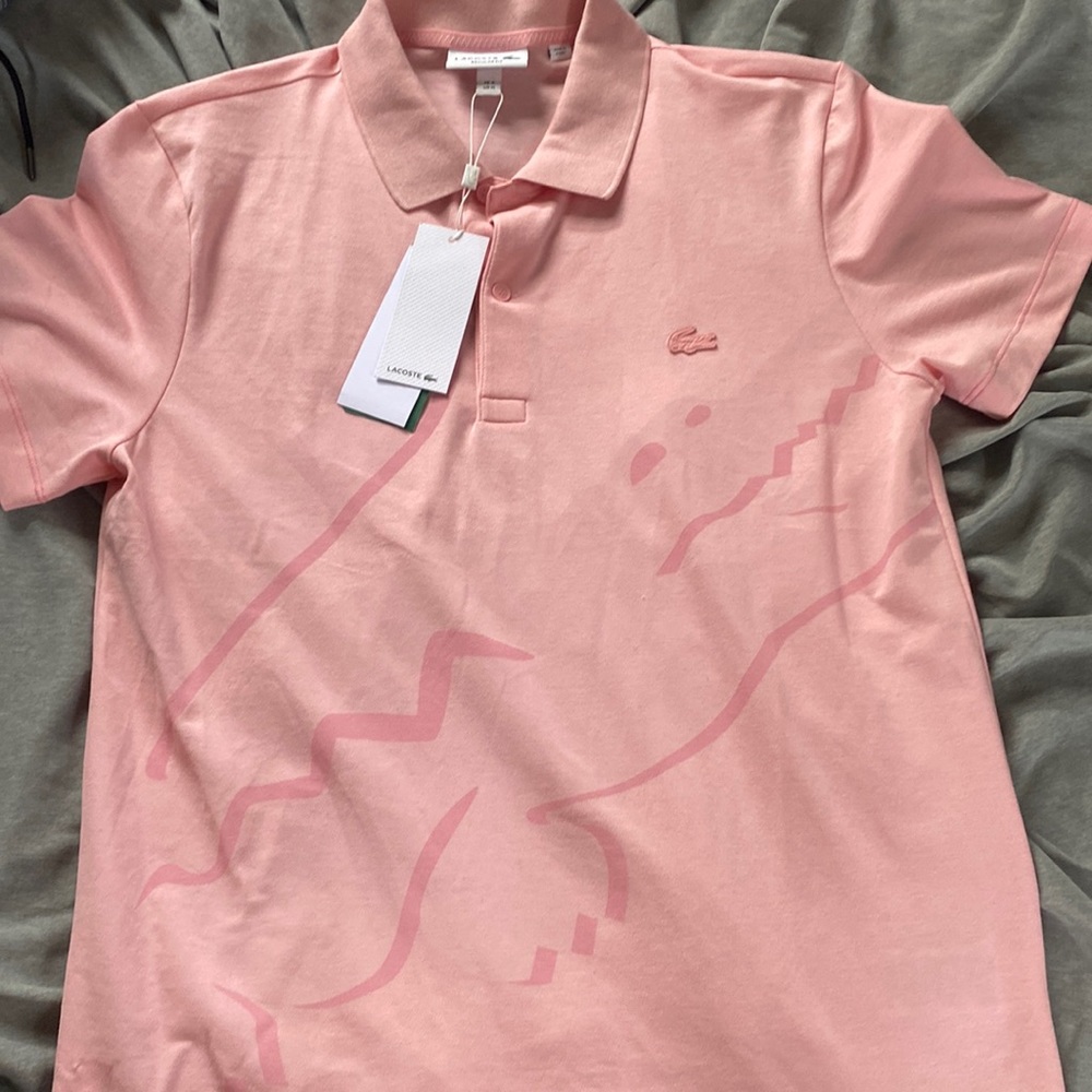 Pink Lacoste shirt brand new in great condition size M